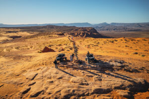 Group of off-road riders with UTVs overlooking Sand Hollow’s desert trails from Top of the World viewpoint