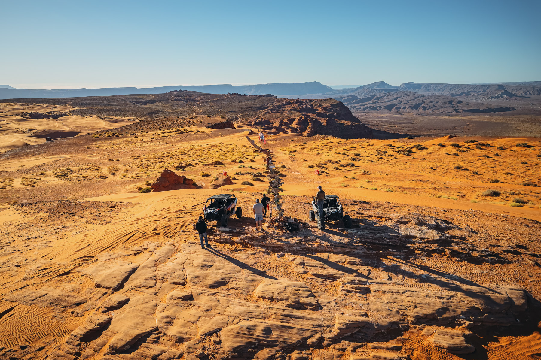 Group of off-road riders with UTVs overlooking Sand Hollow’s desert trails from Top of the World viewpoint
